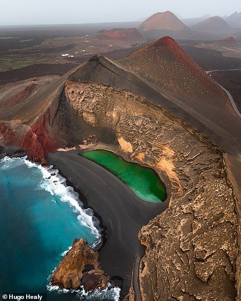 An otherworldly shot of Lanzarote's Charco de los Clicos, or the 'green lagoon'. The lagoon is located by a black-sand beach just south of the village of El Golfo inside the ocean-eroded semi-circular remains of a volcanic cone that's connected to the Atlantic via subterranean passageways, so the water is continually topped up. Shedding light on his photography style, the photographer says that he loves using drones as they 'open up the opportunity to pretty much capture any angle you can dream Canary Islands Lanzarote, World Most Beautiful Place, Wonderful Nature, Castles In Scotland, Aerial Photo, Black Sand, Beautiful Places In The World, Canary Islands, Drone Photography