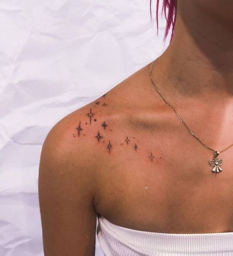 Minimalist stars tattoo on the shoulder. | Star tattoos, Small shoulder tattoos, Shoulder tattoos for women Sparkle Tattoo On Neck, Dainty Top Of Shoulder Tattoo, Collar Bone Tattoos Stars, Subtle Collar Bone Tattoo, Twinkle Tattoo Design, Dainty Tattoos Collar Bone, Simple Collar Bone Tattoos For Women, Stars Collar Bone Tattoo, Star Tattoos Collar Bone