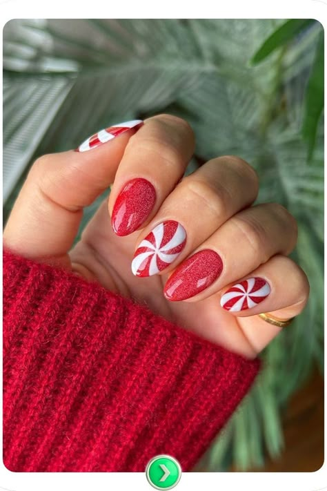 Short red nails with peppermint swirl details, creating a fun and festive Christmas nail design perfect for holiday cheer. Short Almond Christmas Nails Grinch, Fun Holiday Nail Designs, 2025 Christmas Nails, Christmas Nails Peppermint Swirl, Short Nails Art Christmas, Christmas Nail Ideas Candy Cane, Simple Christmas Nails Design, Peppermint Nail Designs, Present Christmas Nails