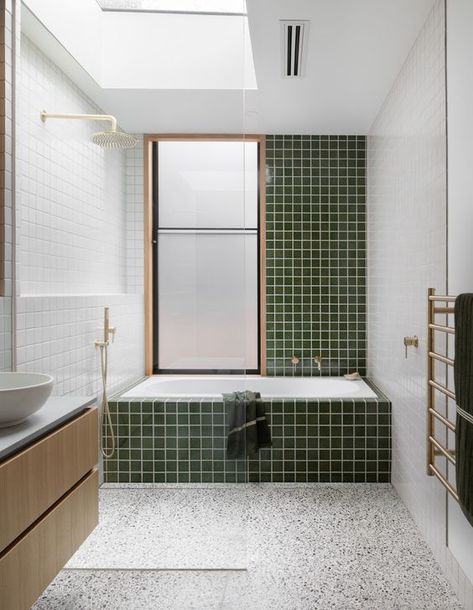 an airy mid century modern bathroom with a terrazzo floor, green and white tiles, a bathtub, a floating vanity and gold fixtures Mid Century Modern Bathroom Decor, Midcentury Modern Bathroom, Green Tile Bathroom, Mid Century Modern Bathroom, Mid Century Bathroom, Bad Inspiration, Hall Bathroom, Terrazzo Flooring, Modern Bathroom Decor