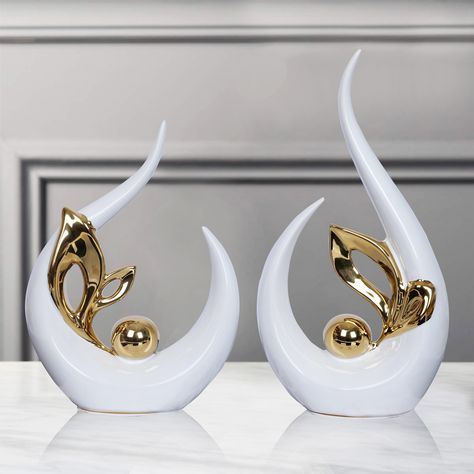 PRICES MAY VARY. Modern Abstract Art Decor size 9.8"H x 5"L x 2.5"W. Small Ceramic Statue 8" high x 6" long x 2.5" wide.Can blend perfectly with most living room decor.Ceramic sculpture can be a perfect art piece for dining room or living room or office decor, coffee table decor [HOME DECOR AESTHETIC]White and Gold Decor made of ceramic material, is an eye-catching piece. After being electroplated and polished, it shows off a mirror-like effect that will never fade [A GIFT EVERYONE LOVES] modern Silver Console Table Styling, Center Peice Decor, Black White And Gold Home Decor, Gold White Office Decor, Show Pieces For Living Room, Show Pieces Decor, Show Piece Ideas For Home, Entrance Table Decor Ideas, Gold Living Room Decor Ideas