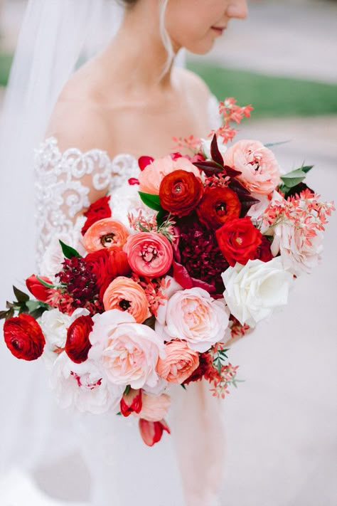 Blush and red bridal bouquet with peonies, garden roses, ranunculus, and tulips. Photo: Susie and Will Peonies And Rose Bouquet, Blush Red Wedding, Red Bridal Flowers, Bold Bridal Bouquet, Flowers For Red Dress, Rannaculus Flower Wedding, Ranunculus And Rose Bouquet, All Red Bouquet, February Bouquet