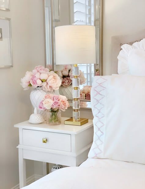 Flower Home by Drew Barrymore – The Decor Diet  White ginger jar, faux pink peonies nightstand glam bedroom Peony Room Decor, Flowers In The Bedroom, White Night Stand Decor, Flowers On Nightstand Aesthetic, Flower In Bedroom, Townhouse Home Decor, Bedroom Nightstands Ideas, Flowers In Bedroom Aesthetic, White Nightstand Bedroom Ideas