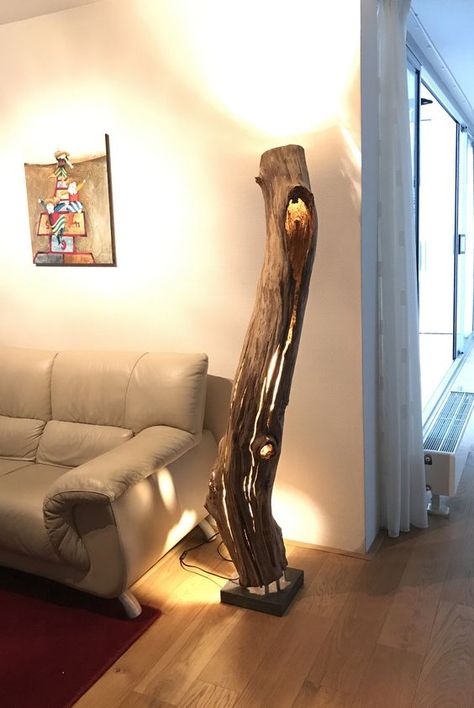 a large floor lamp made of a weathered and old hollow oak trunk for a natural feel Seni Resin, Indoor Floor Lamps, Wood Lamp Design, Driftwood Lamp, Luxurious Interior Design, Large Floor Lamp, Unique Floor Lamps, Floor Lamps Living Room, Rustic Lamps