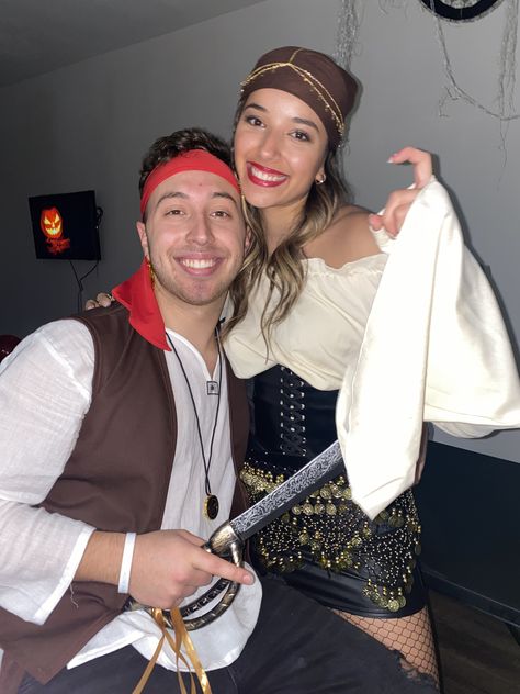 Couples Costumes Pirate, Pirates Couples Halloween Costume, Pirates Couple Halloween Costumes, Guy Pirate Costume Diy, Boy Pirate Costume, Pirate And Parrot Costume Couple, Pirate Couple Halloween Costumes, Matching Pirate Costumes, Pirates Of The Caribbean Couple Costume