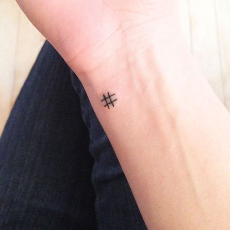 Hashtag symbol tattoo on the wrist  Tiny hashtag symbol tattoo on the left side of the inner wrist Tattoos Masculinas, Small Symbol Tattoos, Small Rib Tattoos, Small Quote Tattoos, Flower Wrist Tattoos, Small Tattoos With Meaning, Tasteful Tattoos, Small Girl Tattoos, Small Tattoos Simple