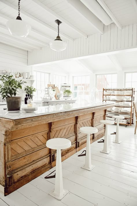 33 Kitchen Island Ideas With Seating to Suit Any Space or Layout Islands That Look Like Furniture, Weathered Kitchen Island, Kitchen Island With Brass Foot Rail, Antique Store Counter Kitchen Island, Old World Kitchen Island, Antique Island Kitchen, Kitchen Island Styles, Farm Kitchen Island, Cool Kitchen Island