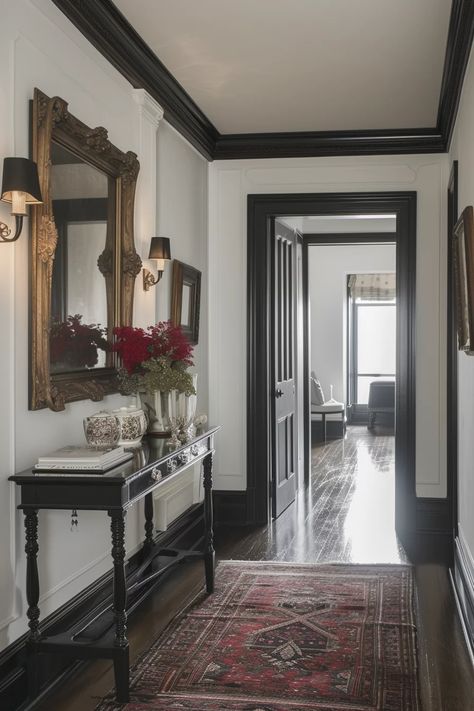 13 Chic Room Ideas Featuring White Walls With Black Trim Dark Walls Black Trim, White Room Dark Trim, Black Box Trim Wall, Black Painted Trim Interior, Painted Moldings And Trim Living Room, Black Vs White Trim Interior, White Wall Brown Trim, Black Trim Hallway, White Doors Black Trim