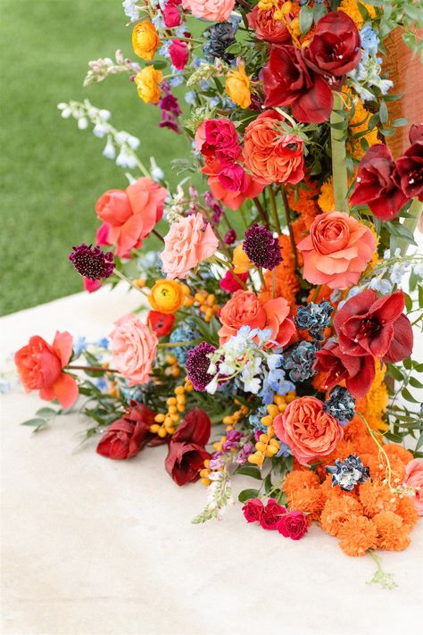 Pink and Orange Wedding Flower Inspiration | The Floral Eclectic My favorite way to add more dimension to an overall warm-colored wedding flower arrangement is to add accents of cooler colors like baby blue and periwinkle. If you’re looking for a similar vibe, pin for inspiration! Red Orange Pink Blue Wedding, Pink Orange Green Wedding Flowers, Sunset Wedding Florals, Orange Pink And Blue Wedding, Red Orange Wedding Theme, Pink Orange Wedding Theme, Blue Orange Pink Wedding, Fall Colorful Wedding, Pink Orange And Blue Wedding