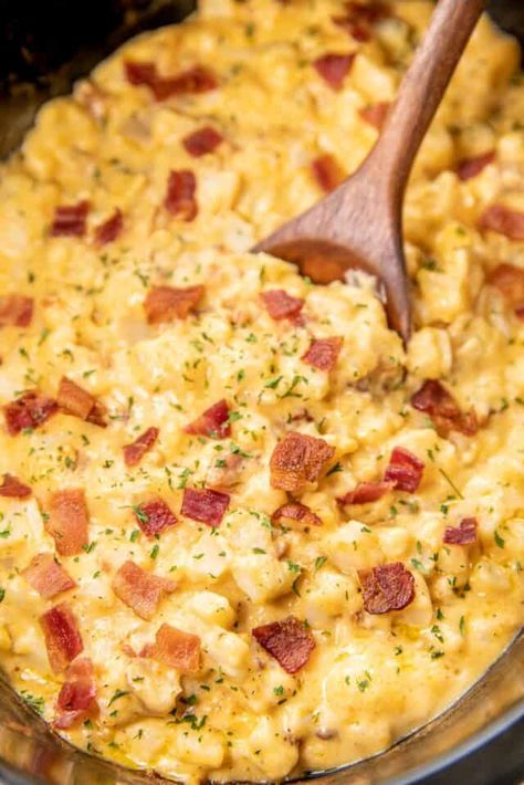 Slow Cooker Cheesy Bacon Potatoes - our go-to potato casserole! Super simple to make and tastes amazing. Simply mix together frozen diced potatoes, cream of potato soup, cream of chicken soup, sour cream, cheddar cheese, and cooked bacon in the crockpot and cook. The potatoes are super creamy and delicious. This is a great recipe for potlucks, cookouts, dinner parties, and the holidays! Give this a try the next time you need an effortless side dish. Potato Recipes Crockpot, Plain Chicken Recipe, Cheesy Bacon Potatoes, Bacon Potatoes, Slow Cooker Bacon, Slow Cooker Potatoes, Cream Of Potato Soup, Crock Pot Potatoes, Quick Side Dishes