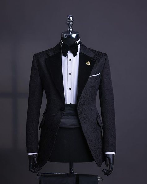 A charcoal black, floral notch lapel tuxedo suit, tux pant trosuer & bow tie  What you get :  suit pant trousers Tie  Other items on request:  Signature Accessories Shirt  Price - available on website  To Order:  iMessage, Text or WhatsApp : +2348179435662 Email: info@dejiandkola.com Website: www.dejiandkola.com Tuxedo For Men Black Classy, Tuxedo For Men Wedding Classy, Black Tuxedo Wedding, Imessage Text, Modern Tuxedo, Designer Tuxedo, Wedding Suit Styles, Smart Fashion, Suit Styles