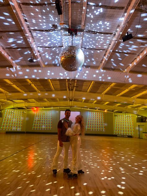 Engaged couple in roller skates under disco ball at roller rink 70s Theme Engagement Party, Roller Rink Wedding Reception, Budget Engagement Party, Disco Engagement Party, Valentines Disco, Roller Disco Party, Unique Engagement Party, Roller Rink, Roller Disco