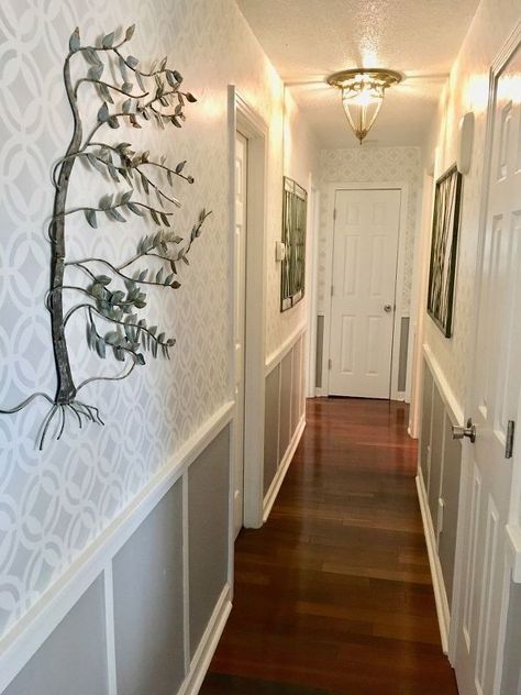 stenciled hallway finally finished Hallway Makeover Before And After, Hanging Family Pictures, White Hallway, Hallway Makeover, Plastic Ceiling, Accent Wall Stencil, Cinder Block Walls, Faux Panels, Narrow Hallway Decorating