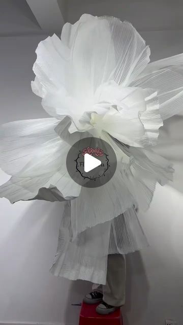 Flowerva Le on Instagram: "Accordion pleated organza combined with paper art creates a whimsical and ethereal fusion, adding an enchanting touch to any setting. #mothersdaycelebration #fabriclove #creativegifts #holiday #holidaydecor #fabricdesign #design #fabricstore #store #Flowerva #weddingdecor" Elegant Organza Dress With Voluminous Skirt, Elegant Voluminous Organza Dress, Giant Organza Flowers, Organza Sculpture, Giant Flower Installation, Organza Giant Flower, Organza Flowers, Giant Flowers, Fabric Store