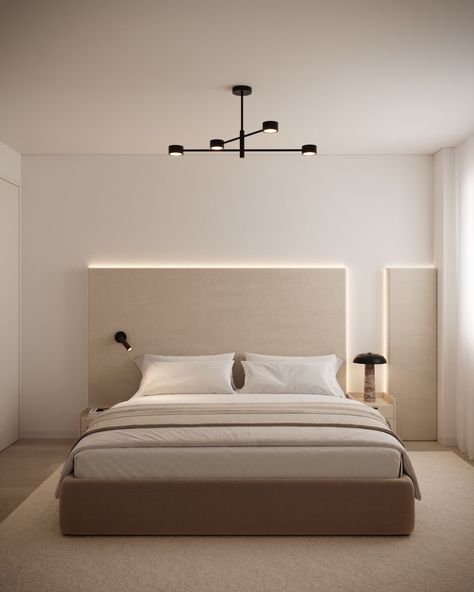 A serene bedroom featuring a neutral color palette with a large upholstered bed, soft bedding, and a minimalist headboard with subtle backlighting. A modern black ceiling light fixture adds a contemporary touch, while simple bedside tables hold elegant lamps, creating a calm and cozy atmosphere. Minimalist Bedroom With Carpet, Neutral Color Room, Minimalist Headboard, Bedroom With Carpet, Black Ceiling Light, Simple Bedside Tables, Color Room, Black Ceiling Lighting, Serene Bedroom