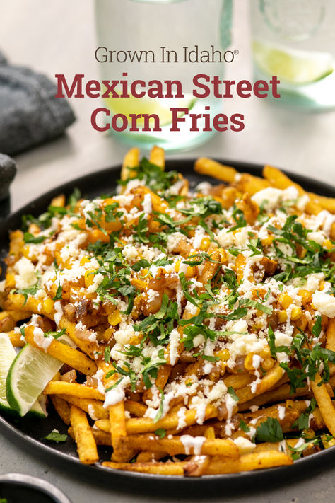 Looking for a delicious, approachable meal for your next get together? Look no further than these spicy Mexican Street Corn Fries. Grown In Idaho® Shoestring Fries are loaded with corn, onion, Cotija cheese, sour cream, lime, and cilantro for a burst of flavor in every bite. Side For Street Tacos, Mexican Street Corn Fries, Lazy Vegetarian Recipes, Hot Day Meals, Street Corn Fries, Corn Fries, Street Fries, Bakes Recipe, Shoestring Fries