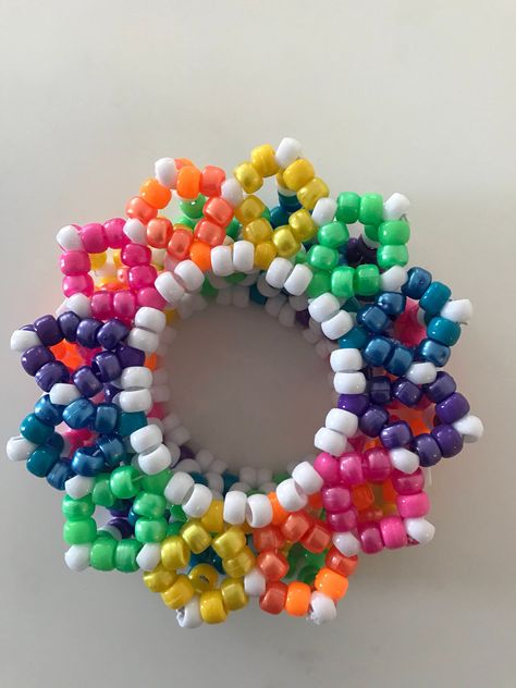 A beautiful rainbow carousel Kandi cuff. It's automatically a 36 beaded X base to even out the color pattern. These are made to order so please allow 5 to 7 days in processing time. If you have any questions feel free to ask :) Kandi Carousel Cuff, Rainbow Kandi, Rave Kandi Ideas, Scene Kandi, Kandi Cuff Patterns, Pony Bead Crafts, Diy Kandi, Kandi Kid, Kandi Cuff