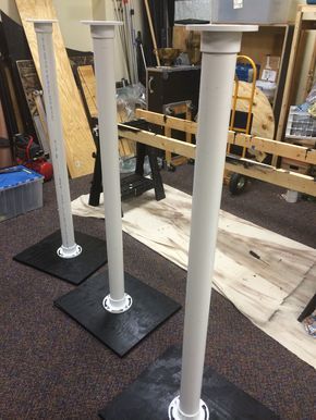 MacKenzie Stephens from Okolona Christian Church in Louisville, KY brings us these cool lamp posts. For their 2014 Christmas stage set, they utilized a park theme. To do this, they needed to build lampposts; so they created them out of 10’ sticks of schedule 40 PVC pipe. They started by measuring and drilling out a 3” toilet flange and bolting them to plywood that they already had laying around (18”x24” and 3/8” thick). Before they bolted the flanges on, they painted the plywood black an... Diy Wedding Backdrop Reception, Wedding Backdrop Reception, Christmas Lamp Post, Cool Lamp, Christmas Stage, Pvc Pipe Crafts, Pvc Pipe Projects, Lamp Posts, Pvc Projects