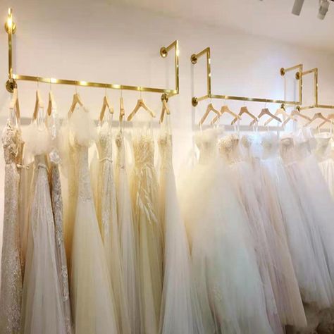 Bridal Shop Boutique Store Garment Stainless Steel Wall Mounted Women Clothes Stand Wedding Dress Gold Wall Clothing Racks https://m.alibaba.com/product/1600295678062/Bridal-Shop-Boutique-Store-Garment-Stainless.html?__sceneInfo={"cacheTime":"1800000","type":"appDetailShare"} Wall Clothing Rack, Clothing Boutique Decor, Bridal Shop Interior, Bridal Shop Decor, Wedding Dress Display, Bridal Shop Ideas, Boutique Interiors, Bridal Boutique Interior, Golden Wall