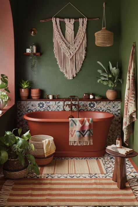 Bohemian bathroom featuring deep green walls, terracotta accents, patterned tiles, and a freestanding bathtub. Bathroom Bohemian Style, Cozy Eclectic Bathroom, Green Color Scheme Bathroom, Rust And Green Bathroom, Small Earthy Bathroom Ideas, Terracotta And Sage Bathroom, Mid Century Boho Bathroom, Dark Boho Bathroom Ideas, Boho Green Bathroom