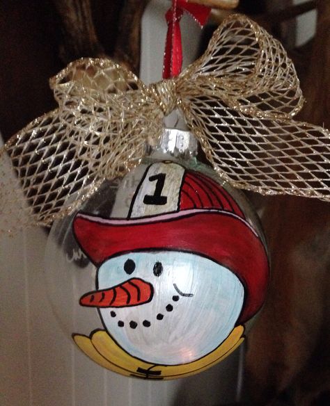 I freehand painted a glass ornament with Fire Fighter Snowman. Fireman Ornaments Diy, Fire Department Christmas, Firefighter Crafts, Firefighter Decor, Bulb Ornaments, Fire Wife, Christmas Rock, Painted Christmas Ornaments, Firefighter Gifts