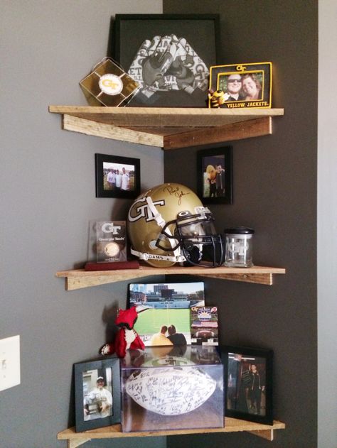 Sports Home Office, Man Cave Shelf Decor, Sports Themed Office Ideas, Home Office Sports Memorabilia, Man Cave Memorabilia Display, Small Bedroom Man Cave Ideas, Mens Office Decor Home Sports, Sports Display Ideas, Man Cave Paint Ideas