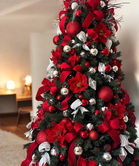 Transform your office or home this holiday season with our luxurious red and silver Christmas tree! 🌟🎄 Stunning poinsettias, bold bows, and festive ornaments make this tree the perfect centerpiece for your celebrations. Book now for delivery and setup to enjoy hassle-free holiday magic! #ChristmasTreeHire #HolidayDecor #FestiveSeason #Christmas2024 #HolidayVibes #christmastreehiresunshinecoast White Silver Red Christmas Tree, Red And Silver Christmas Tree Ideas, Red White And Silver Christmas Tree, Silver Red Christmas Tree, Red Silver Christmas Tree, Silver And Red Christmas Tree, Christmas Tree Red And Silver, Red And Silver Christmas Tree, Luxurious Christmas Tree