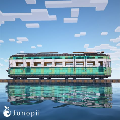 Minecraft build of a turquoise colored Japanese retro train car in the middle of the ocean. Minecraft Subway Train, Train Track Minecraft, Minecraft Japanese Train Station, Minecraft Train Design, Minecraft Train Station Ideas, Minecraft Subway, Retro Minecraft, Car Minecraft, Minecraft Train Station