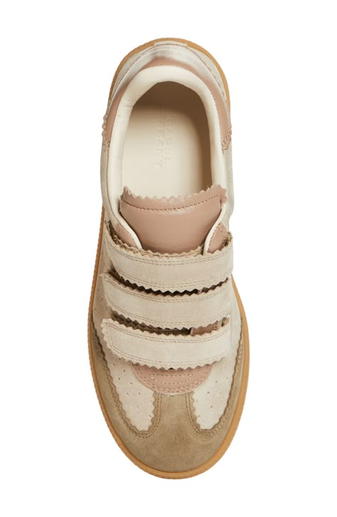 Smart pinking traces the contours of an easy-going sneaker styled with a low-top profile and dot perforations racing up the sides. Adjustable hook-and-loop straps Leather upper and lining/rubber sole Made in Portugal Women's Designer Shoes Neutral Sneakers Women, Designer Wishlist, Cream Sneakers, Cool Sneakers, Isabel Marant Sneakers, Woman Sneakers, Cool Girl Style, Crochet Lace Edging, Shoe Inspo