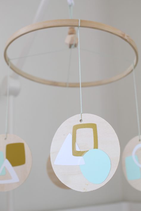 This DIY modern geometric nursery mobile is the perfect mix of form and function to hang over your beloved little one. Twin Boys Room, Abstract Nursery, Geometric Nursery, Cricut Mat, Nursery Modern, Wood Circles, Easy Art, Twin Boys, Nursery Mobile