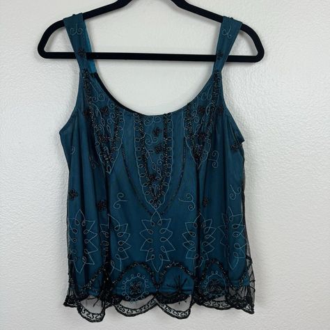 Nwt Vintage Marina Beaded Embroidered Tank Top Camisole Teal Black Large A Beautiful Vintage Top By Marina. Teal Blue Lining With A Sheer Black Mesh Overlay. Embellished With Embroidery And Beading Throughout. Scalloped Hemline. Sleeveless, Tank Top Style. Back Zip With Hook And Eye Closure. New With Tags. Has Some Missing Beading On Top Left Shoulder. See Photos For Details. Does Has Pack Of Extra Beads Attached To Tag. Size Large. Approximate Measurements: Armpit To Armpit-18" Length-23" #Whimsygoth #Fairycore #Y2k #Holiday #Glamorous Y2k Beaded Top, Inspo Fits, Thrift Inspo, Embroidered Tank Top, Embroidered Tank, Mesh Overlay, Beaded Top, Tank Top Camisole, Sleeveless Tank Top