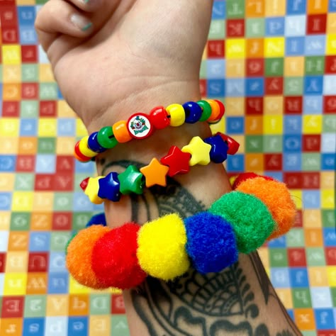 Clown pom pom beaded bracelet set clowncore accessories jewelry primary  Handmade clown bead bracelet set of 3 with chunky pom Pom bracelet and handmade fimo clay clown bead  *CLOWN BEAD MAY CHANGE TO HAPPY FACE BEAD DEPENDING ON AVAILABILITY! Perfect accessories to any fun outfit! Or cosplay Tags;clown birthday party circus rave kidcore weird weirdcore kandi Clown Core Accessories, Clowncore Accessories, Clown Core Fashion, Clown Kandi, Clown Jewelry, Clowncore Clothes, Kidcore Accessories, Clowncore Fashion, Clowncore Outfit