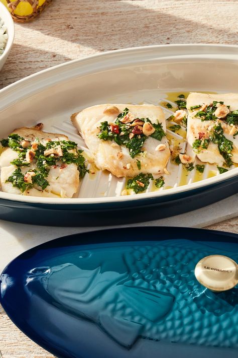 A bright, tangy citrus vinaigrette and herb sauce perfectly complement the flavors of halibut in this deliciously simple and elegant recipe. It comes together quickly making it perfect for a weeknight dinner, but also impressive enough for entertaining guests when served table-side in the Le Creuset Fish Baker. Baked Halibut, Whole Fish Recipes, Le Creuset Recipes, Halibut Recipes, Citrus Vinaigrette, Le Creuset Cookware, Kitchen Wares, Herb Sauce, Dutch Oven Recipes