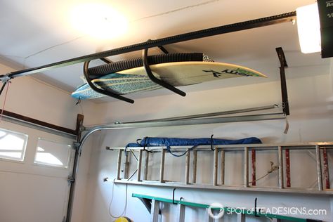 Surfboard rack fits above the garage door! #organization #garage #mancave | spotofteadesigns.com Surfboard Storage Garage, Door Organization, Surfboard Wall Rack, Surfboard Storage, Organization Garage, Organized Garage, Surfboard Rack, Garage Roof, Surfboard Wall