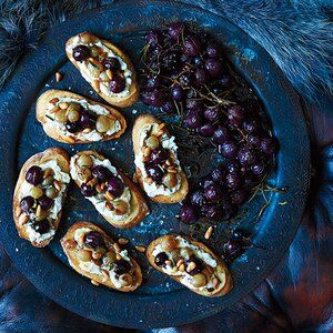 Ricotta and Roasted Grape Crostini Recipe - Athena Calderone | Food & Wine Grape Crostini, Italian Brunch, Toast Toppers, Creamed Kale, Cocktail Party Food, Crostini Recipes, Holiday Cocktail Party, Brunch Dishes, Christmas Appetizers