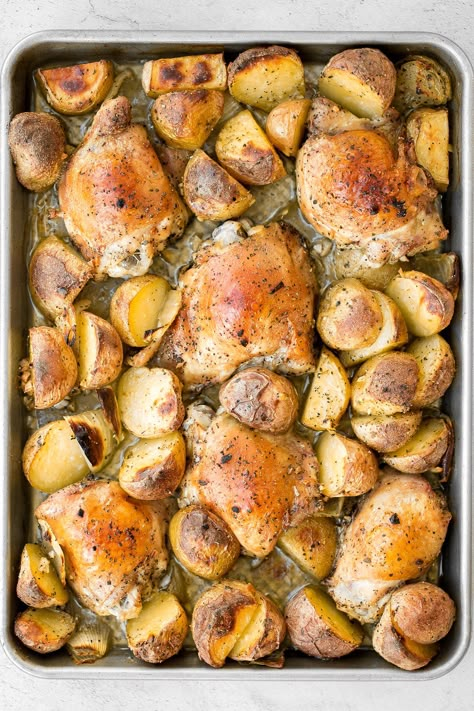 One pan garlic roasted chicken and baby potatoes is an easy to make, delicious, and wholesome meal for the entire family. Prep this sheet pan in 10 minutes. | aheadofthyme.com Roast Chicken And Potatoes, Garlic Roasted Chicken, Baked Garlic Parmesan Chicken, Garlic Mashed Cauliflower, Easy Fall Dinners, Sheet Pan Meals Chicken, Chicken Shawarma Recipe, Roasted Garlic Chicken, Chicken And Potatoes