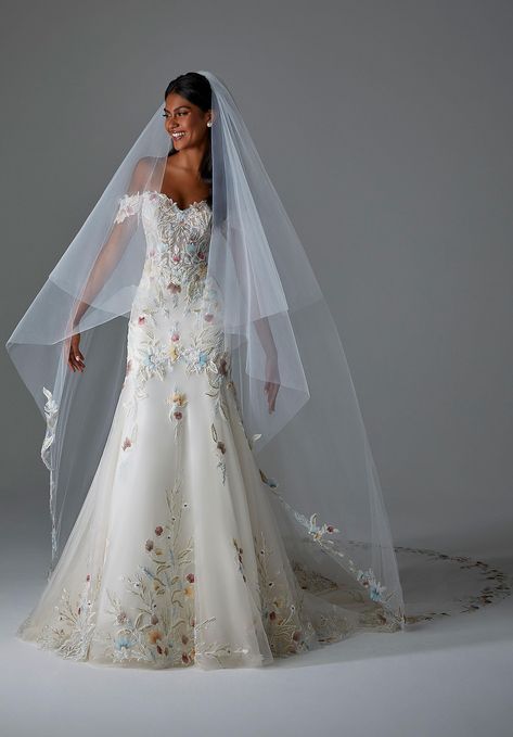 By Morilee - front of dress White Wedding Dress With Colored Flowers, Floral Tulle Wedding Dress, Unique White Wedding Dresses, Morilee Persephone, Unique Wedding Veil Ideas, White Wedding Dress With Flowers, Bridgerton Wedding Dresses Inspired, Colorful Floral Wedding Dress, Wedding Dresses Aurora