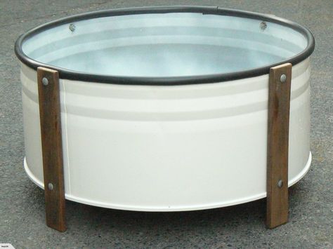 PLANTER BOX: | Trade Me ~ Up-cycled from a steel 44 gallon drum (cleaned and spray painted) and the timber legs were sanded and oiled and attached with galvanised bolts, top rim has a plastic bead to protect from cut edge of drum. Steel Drum Ideas, 44 Gallon Drum Ideas, Vege Garden, 55 Gallon Drum, Car Furniture, Diy Workbench, Barrel Furniture, Oil Drum, Steel Barrel