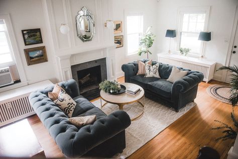 A living room designed by Victoria Sass shows Chesterfield-style sofas flanking a coffee table that is set next to a fireplace. Sofas Flanking Fireplace, White And Grey Living Room, Grey Living Room Decor, Chesterfield Sofa Living Room, Sofas Luxury, Mirrored Coffee Table, Living Room Decor Gray, Chesterfield Sofas, Living Room Decor Inspiration