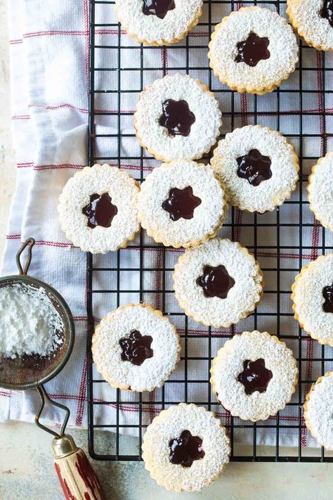 My crisp, buttery Linzer Cookies are about to become your favorite sandwich cookie recipe. With almond-scented cookie dough and a sweet raspberry filling, this classic Christmas cookie recipe will stand out from the cookie swap competition. Lingonberry Jam, Linzer Cookie, Ikea Meatballs, Linzer Cookies Recipe, Cookie Sandwich Recipes, Christmas Cookie Recipe, Sandwich Cookie, Linzer Cookies, Raspberry Almond