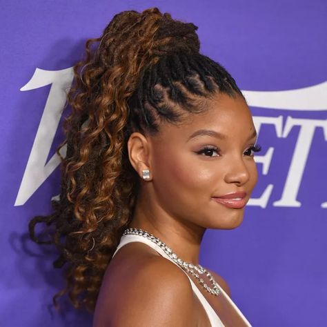 15 of Halle Bailey's Best Hair Looks Bun Braid Hairstyles, Halle Bailey Hair, Loc Ponytails, Weave Ponytail Styles, Straight Back Braids, Bun Braid, Keeping Hair Healthy, Medium Box Braids, Weave Ponytail