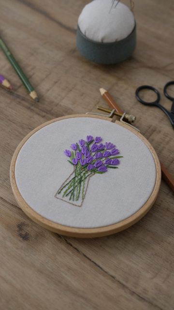 Stitch Forest on Instagram: "Hey, I’d like to share the cute tulip stitch with you! It’s a variation of lazy daisy stitch, simple and quick to do. To make things more interesting, you could design the flowering process the way you like by changing the stitch distances! Hope you like it🪡💜 Have a nice weekend😉 . . #handembroidery #fiberart #handstitched #handembroidered #needleart #flowerembroidery #floralembroidery #botanicalembroidery #needlework #stitchery #hoopartembroidery #embroiderypatte Tulip Stitch, Tulip Embroidery, Tulip Stitch Embroidery, Lazy Daisy Embroidery Design Pattern, Embroidery Lazy Daisy, Tulip Flower Embroidery Design, Lazy Daisy Stitch Embroidery Design Motif, Lazy Daisy Embroidery Design, Laizy Daizy Design Embroidery Flower