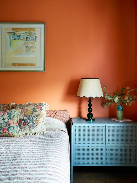 Jewelry Designer Sandra Barrio Gonzales's Pisces Sign Rules The Colors in Her London Home | domino Orange Painted Walls Bedroom, Guest Room Colorful, Colourful Vintage Bedroom, Terra Cotta Bedroom Walls, Clay Colored Bedroom, Teal And Terracotta Bedroom, Orange Walls Bedroom, Nightstand Accents, Orange Wall Bedroom