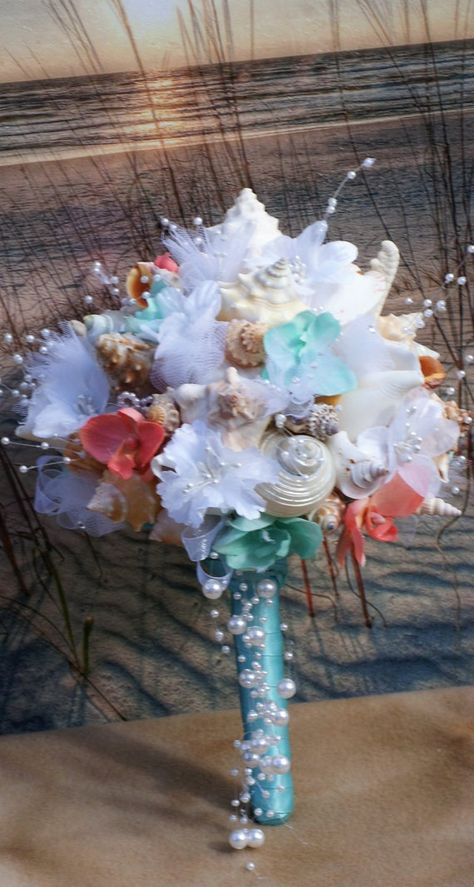 Bridal Bouquet Beach, Ocean Wedding Theme, Beach Wedding Guest Book, Beach Bouquet, Seashell Bouquet, Original Wedding Ideas, Coral And Aqua, Beach Wedding Aisles, Purple And Green Wedding