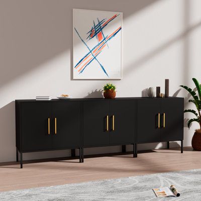 Black Entertainment Center for 80 85 90 inch TV Console Table with Storage for Living RoomFeatures:Modern sideboard: this modern sideboard cabinet has a simple design with a frosted black pattern and luxurious gold handles for a more unique and modern look. Compatible with most room styles, it will bring an eye-catching feel to your living room, dining room, or office. Large storage capacity: this buffet cabinet has 2 doors and 2 big storage spaces. with a 2-layer structure inside the cabinet, w Wide Buffet Cabinet, Long Black Buffet Table, 85 Inch Tv Entertainment Center, Tv Stand For 80 Inch Tv, Tv Stand For 85 Inch Tv, Living Room Console Table Decor Under Tv, 80 Inch Tv Living Room, 85 Inch Tv Living Room, Long Buffet Cabinet