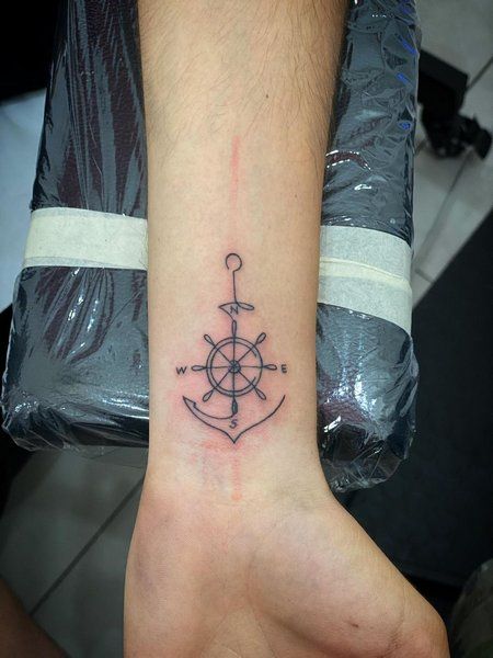 Anchor Tattoo With Semicolon, Anchor Wrist Tattoos For Women, Finger Anchor Tattoo, Small Nautical Tattoo For Women, Simple Anchor Tattoo For Women, Anchor Compass Tattoo Women, Flower Tattoo Designs Shoulder, Anchor And Wheel Tattoo, Anchor Tattoo Design For Men