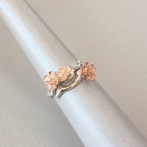 This beautiful Sakura Ring features sterling silver with sterling silver flowers, and we also have rose gold plated over sterling silver flower. Size: Adjustable ring US fit 6-9 You would get a ring with the color of the flower you choose in the option list. *** Please note that the natural Sakura Ring, Tiffany Bracelet Silver, Cherry Blossom Ring, Forward Helix Earrings, Sakura Blossoms, Twig Ring, Ring Flower, Necklace For Girlfriend, Nature Ring