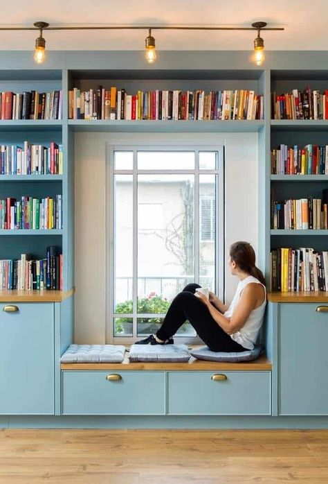 Built In Storage Wall Around Window, Creative Use Of Space, Bookshelf Near Window, Multiple Purpose Room, Bookshelf Bench Under Window, Elevated Reading Nook, Bay Window Bookshelf, Bookshelf Wall Around Window, Den Room Design