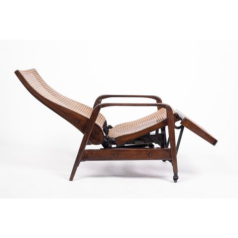 This unique antique Brazilian mechanical recliner lounge chair was made in the early 20th century. This exceptional chair is expertly handcrafted from solid walnut wood and features hand caned seat, backrest and footrest with metal caster wheels on front legs. The original reclining mechanism works as intended and chair changes position from upright to reclining position with ease. A beautiful showpiece.  DIMENSIONS W 24” x D 30” x H 38” Seat Height: 18” Modern Lounge Chair Design, Best Recliner Chair, Wooden Lounge Chair, Chair Design Wooden, Furniture Design Wooden, Rustic Traditional, Unique Chair, Reclining Chair, Outdoor Patio Chairs