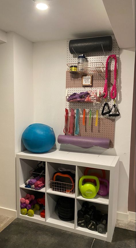 I ordered the shelves and baskets from Walmart - the peg board from Home Depot Peg Board Home Gym, At Home Gym Organization, Basement Office Workout Room, Fitness Storage Ideas, Purple Home Gym Workout Rooms, Workout Equipment Storage Ideas, Home Gym And Den Combo, Ikea Home Gym Hacks, Garage Peloton Set Up